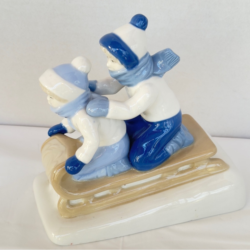 Vintage Paul Sebastian PS Blues Cream Porcelain Holiday Decor Boys Sledding EUC